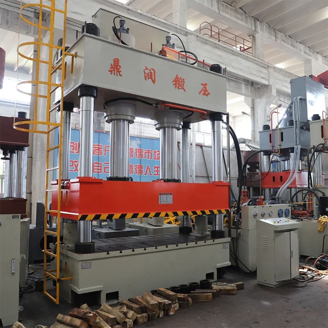 Chinese-built four-column hydraulic press with Chinese machine markings and its original control cabinet